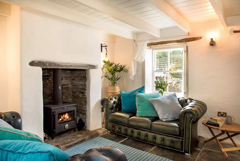 There are beautiful features throughout - hand-made window shutters, original slate floors, and of course that all important wood-burner making this an ideal retreat all year round.