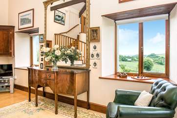 You'll enjoy the view of the garden and surrounding countryside from the sitting-room.