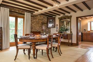 The dining-area is located close to the kitchen - patio doors open up to the Juliet balcony which provides wonderful views of the garden and beyond.