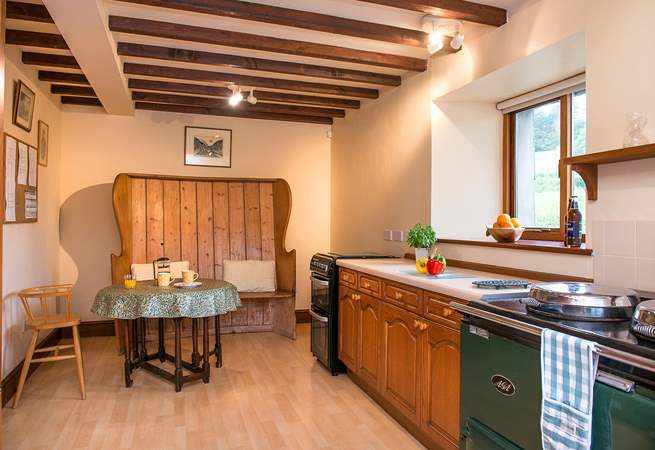 There's a small dining-area in the kitchen - perfect for a quick breakfast or morning coffee. (Please note, for 2023, the Aga is ornamental).
