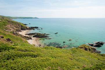 As the tide goes out the tiny coves become a long stretch of golden sand.