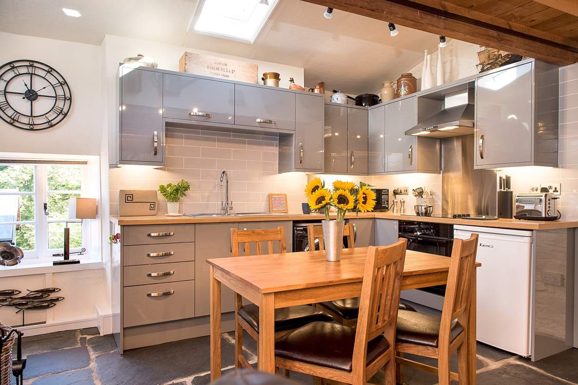 The stylish kitchen and dining-area.
