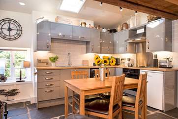 The stylish kitchen and dining-area.
