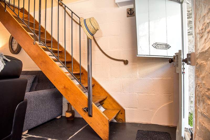 The open-tread stairs that lead up to the bedroom.