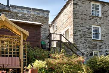 Steps lead down to the garden - the owners live in the cottage to the right.
