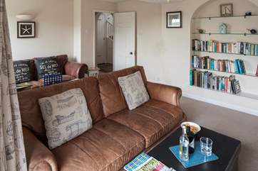 The sitting-room runs almost the whole length of the house.