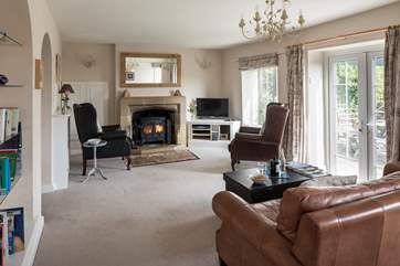 Enjoy the morning sun in the sitting-room, which has a cosy wood-burner for less sunny days and for winter escapes.