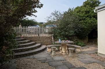 Private parking for two cars is at the back of The Guardhouse, with steps leading down into the rear patio-area.