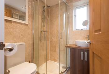 Enjoy a shower in the compact shower room after a day on the nearby beach.