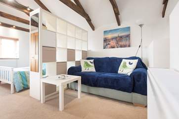 The sitting-area with the bedroom area to the left.