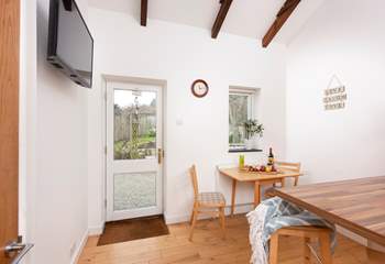 This door leads to a sweet back garden.