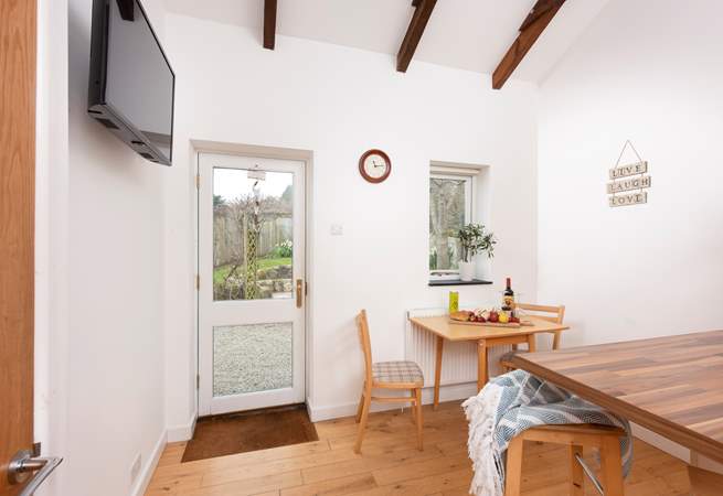 This door leads to a sweet back garden.