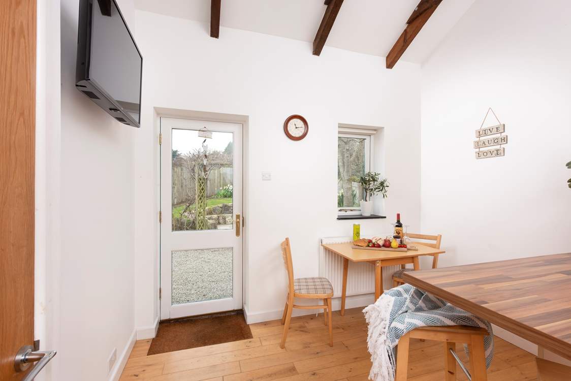 This door leads to a sweet back garden.