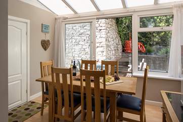 Step out onto the small enclosed patio-area and enjoy the refreshing sea air.