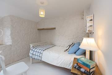 This is the pretty single bedroom with views out over the garden and the countryside beyond.