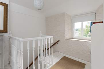 The painted cottage stairs have a bannister and a fitted rope handrail, please take care.