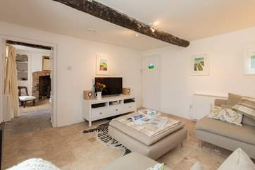 The two reception rooms link one to the other. Both have wood-burning stoves and one has a TV so that you can have one room for watching films etc and one for chatting and being TV-free!