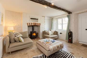 The front door opens into the first of the reception rooms where you can hang your coats.