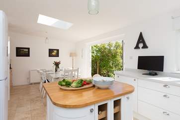 The kitchen/dining-room is stunning. The island is a great addition to this very contemporary and sociable space that has bi-fold doors to the garden.