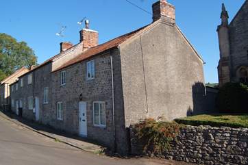 Greenhills is the end cottage in this little row of period stone cottages. This is a very quiet village and the road is not a busy one.