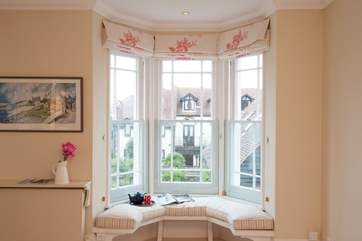 Grab a book and sit in the sunshine coming through the bay window.