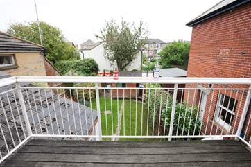 Enjoy a drink out on the balcony on a sunny afternoon.