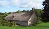 This is the wonderful view down over the farmhouse from the gardens at the rear. - Thumbnail Image