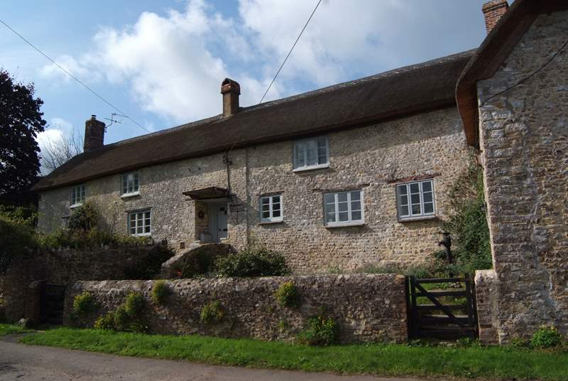 The farmhouse has an enclosed front garden and plenty of parking either to the side of the little no through lane or in the driveway to the side of the house.