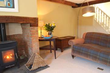 This is the other side of the main sitting-room. The stairs lead up to the master en suite bedroom.