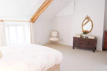 There are some lovely pieces of antique furniture that add to the character of this happy family holiday home.
