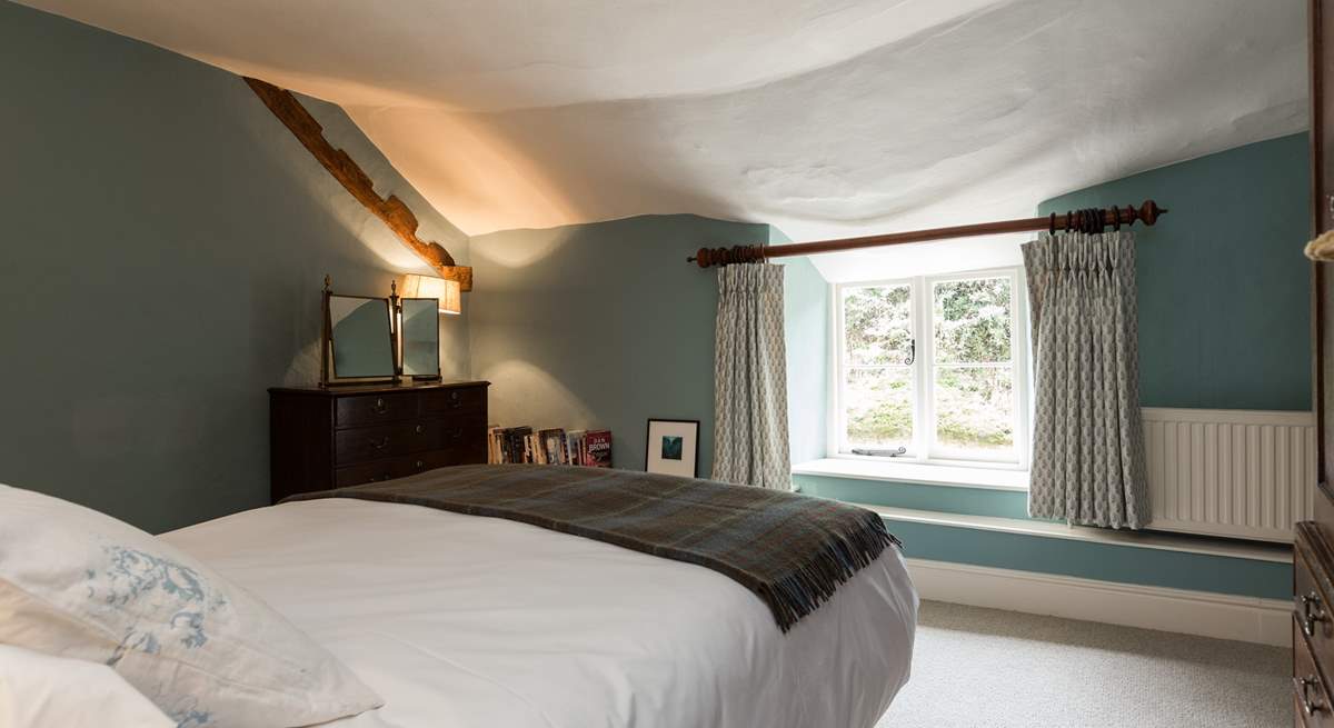 This bedroom looks out to the back of the farmhouse.