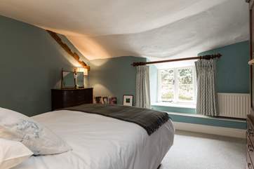 This bedroom looks out to the back of the farmhouse.