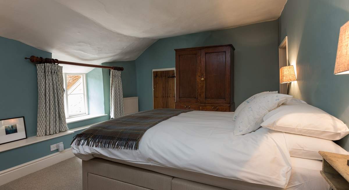 This double bedroom has access to the landing with the family bathroom as well as to the shower-room on the other side. The ceiling is part of the amazing character of this farmhouse!