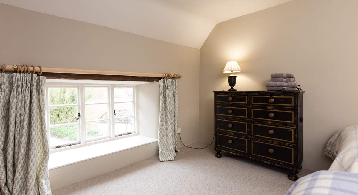 The outlook from this bedroom is at the near end of the farmhouse as you approach down the lane.