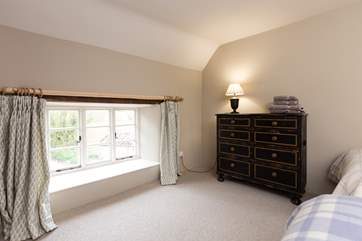 The outlook from this bedroom is at the near end of the farmhouse as you approach down the lane.