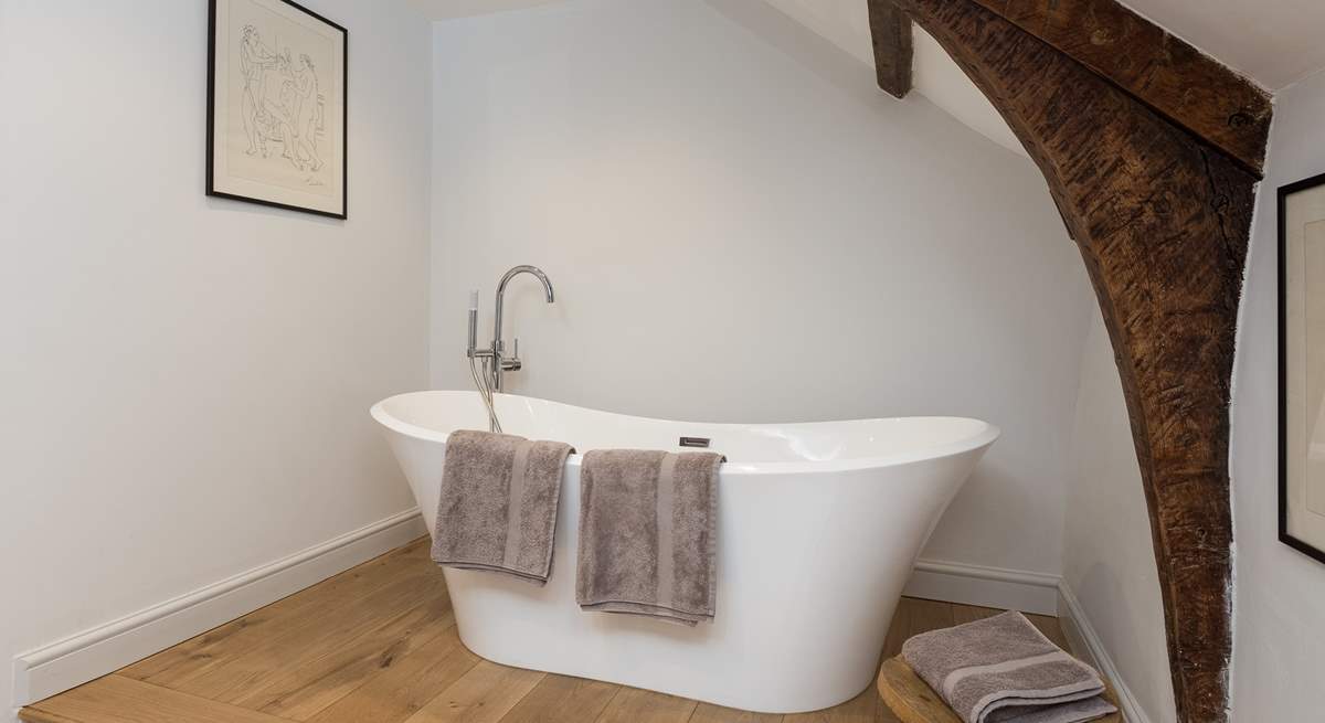 The very stylish family bathroom (the bath is up one step from the rest of the bathroom) is a brand new addition to the farmhouse.