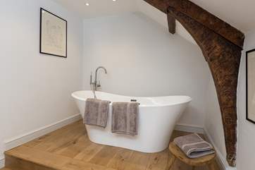 The very stylish family bathroom (the bath is up one step from the rest of the bathroom) is a brand new addition to the farmhouse.