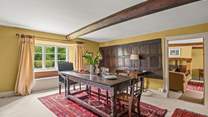 The dining-room still has its historic wooden panelling.