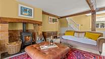 This is the other side of the main sitting-room. The stairs lead up to the main en suite bedroom.