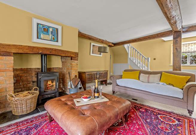 This is the other side of the main sitting-room. The stairs lead up to the master en suite bedroom.