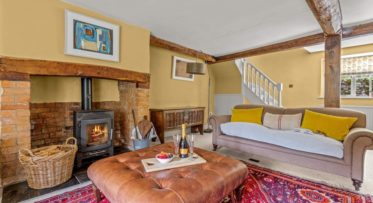 This is the other side of the main sitting-room. The stairs lead up to the master en suite bedroom.