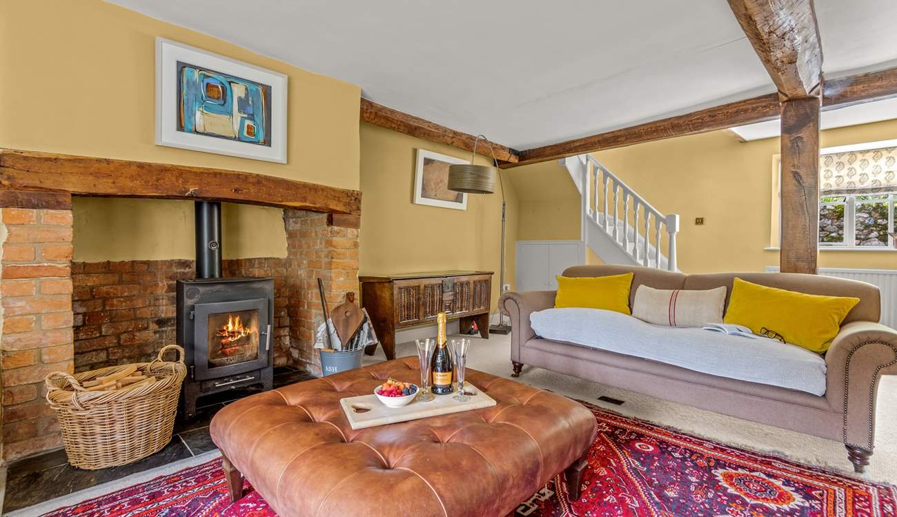 This is the other side of the main sitting-room. The stairs lead up to the master en suite bedroom.