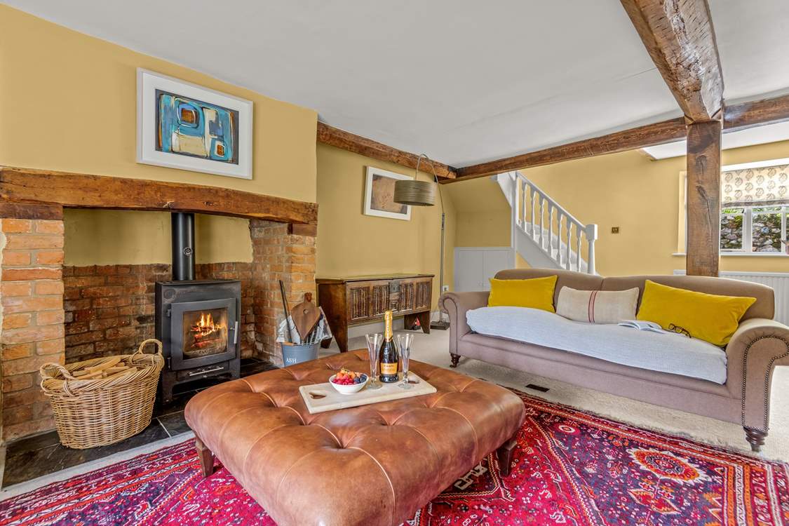 This is the other side of the main sitting-room. The stairs lead up to the master en suite bedroom.