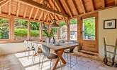This light-filled oak-framed dining-room seats all 12  guests easily. There is direct access outside too. - Thumbnail Image