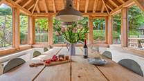 Eating in the garden-room is just as much fun, especially on a summer evening.