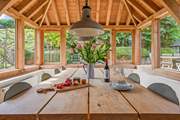 Eating in the garden-room is just as much fun, especially on a summer evening.