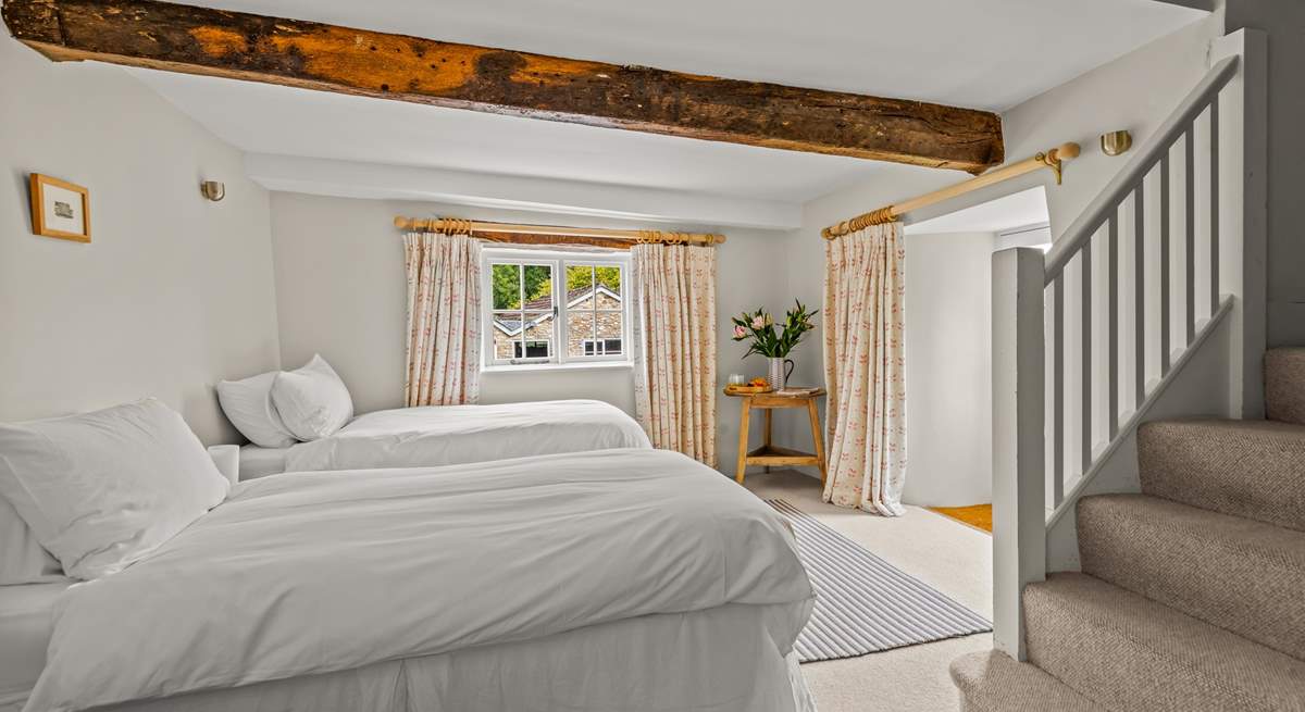 This is the lower ground floor bedroom. This room sleeps 3 guests in 3 single beds, two of which can be pushed together to create the effect of a double. They are not 'zip and link'.