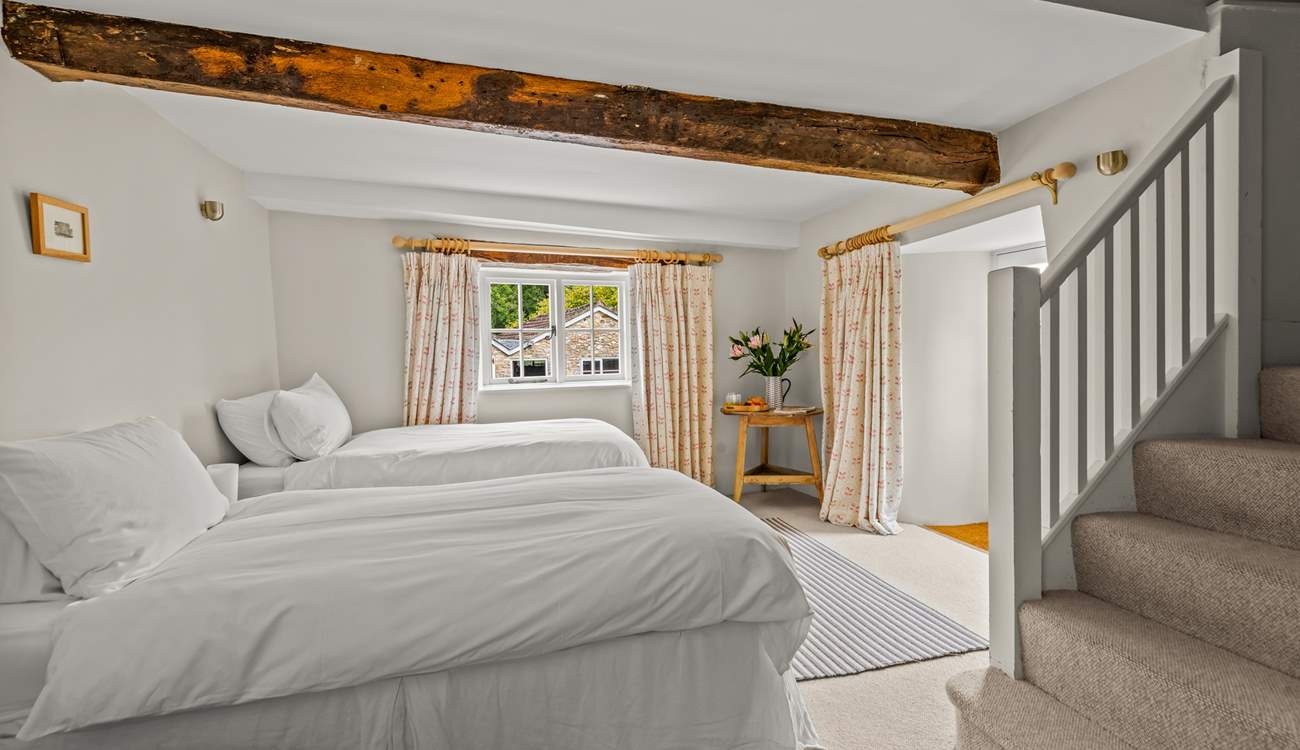 This is the lower ground floor bedroom. This room sleeps 3 guests in 3 single beds, two of which can be pushed together to create the effect of a double. They are not 'zip and link'.