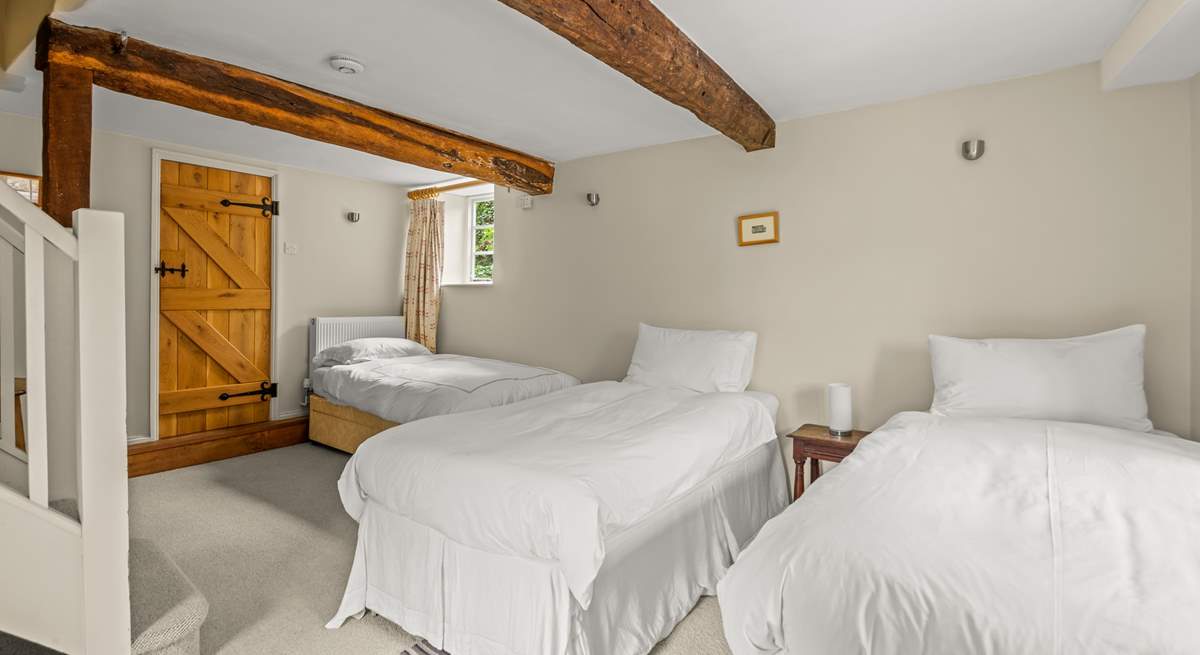 The other single bed is in the corner of the lower ground floor bedroom.