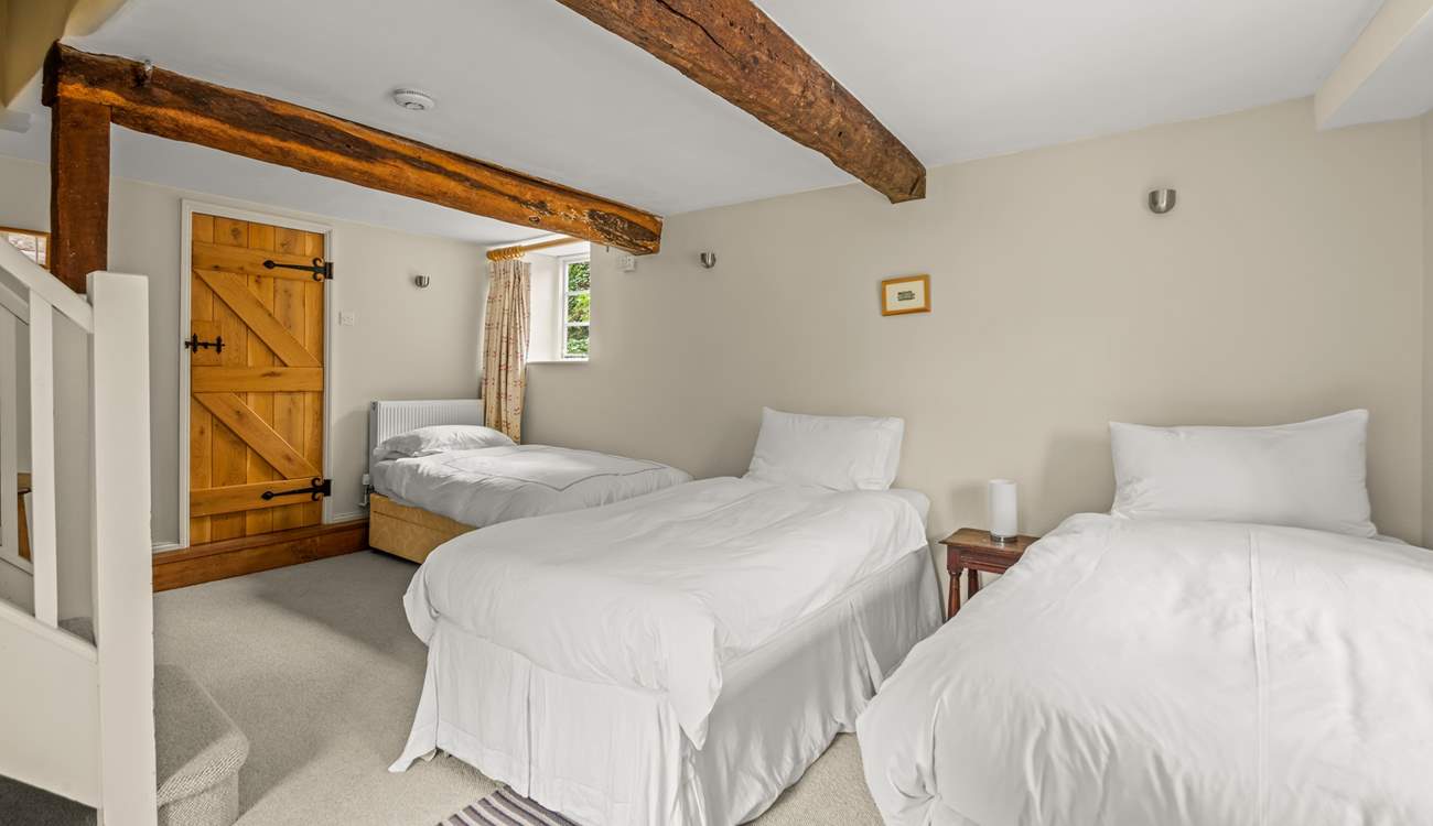 The other single bed is in the corner of the lower ground floor bedroom.